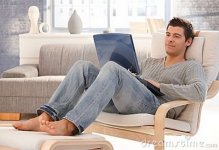 goodlooking-young-man-relaxing-home-laptop-17336645.jpg
