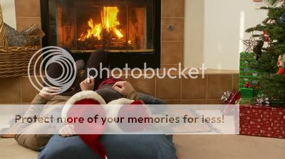 stock-footage-couple-in-santa-claus-hats-laying-in-front-of-the-fireplace.jpg